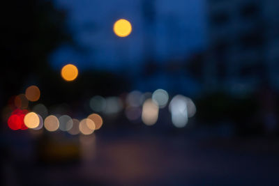 Defocused image of illuminated lights at night