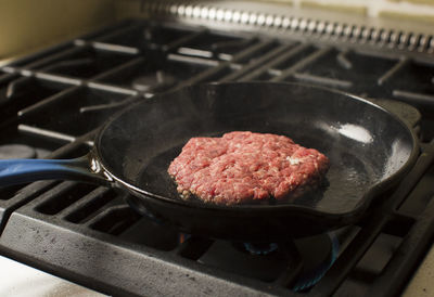 Close-up of meat in cooking pan