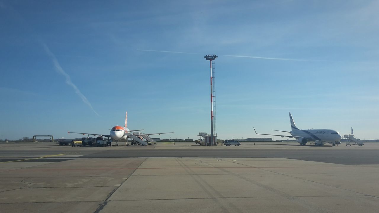 transportation, airplane, connection, sky, outdoors, day, no people, airport runway, bird, air vehicle, passenger boarding bridge