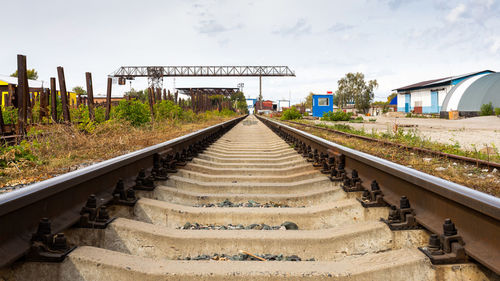 Large plan railroad tracks against the background of a construction site, production workshop