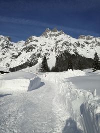 Scenic view of snowcapped mountains against sky