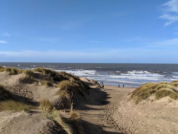 Scenic view of beach against sky