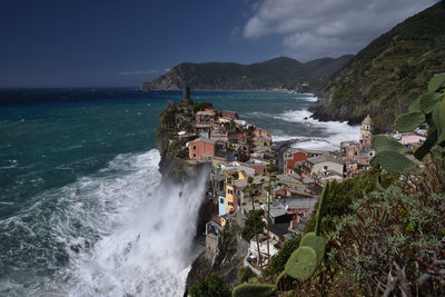 High angle view of sea and buildings against sky