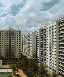 Modern buildings in city against sky