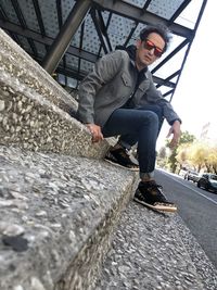 Side view of young man on staircase