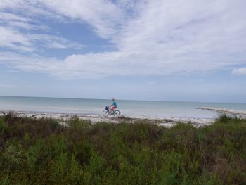 Scenic view of sea against cloudy sky