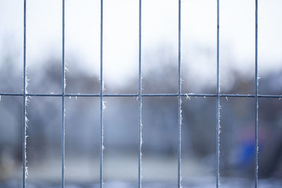 Full frame shot of metal fence during winter