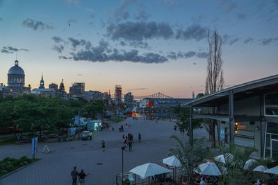 People in city at sunset