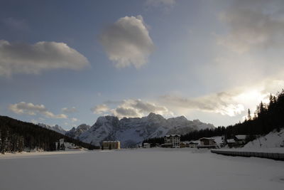 Scenic view of snow covered mountains against sky