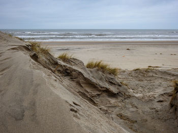 Scenic view of beach against sky