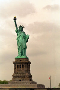 Low angle view of statue against cloudy sky