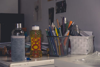 Close-up of multi colored pencils on table at home