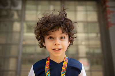 Portrait of happy boy with curly hair