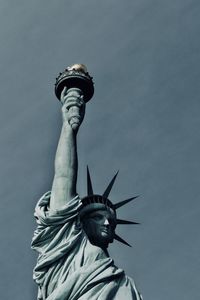 Low angle view of statue against sky