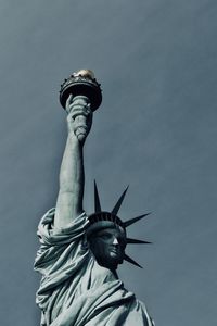 Low angle view of statue against sky