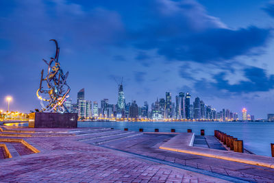 Illuminated buildings in city at night