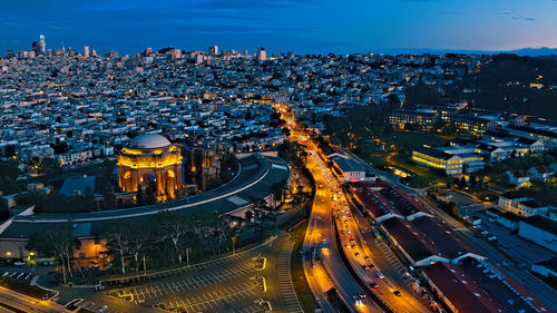 High angle view of illuminated buildings in city