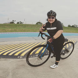 Man riding bicycle on road