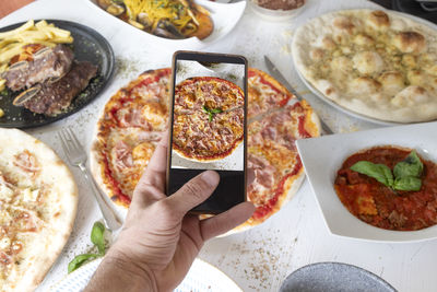 Cropped hand of person preparing food