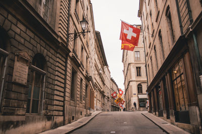 Road amidst buildings in city