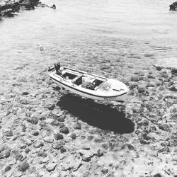 High angle view of abandoned boat moored on beach