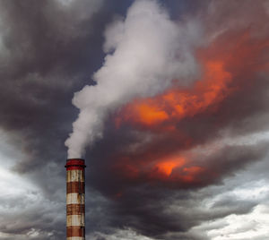 Low angle view of lighthouse against sky during sunset