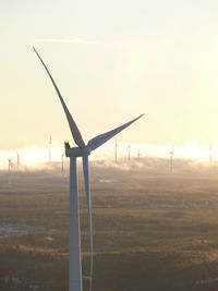 Traditional windmill on field