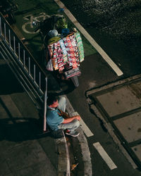 High angle view of boy standing on wall