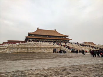 Group of people in temple against building