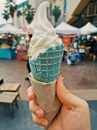 Midsection of person holding ice cream