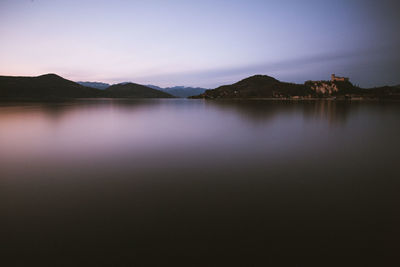 Scenic view of lake against sky during sunset