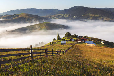 Scenic view of field against mountains