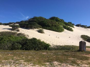 Scenic view of landscape against clear blue sky