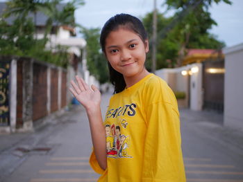 Portrait of young woman using mobile phone