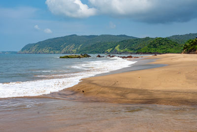 Scenic view of beach against sky