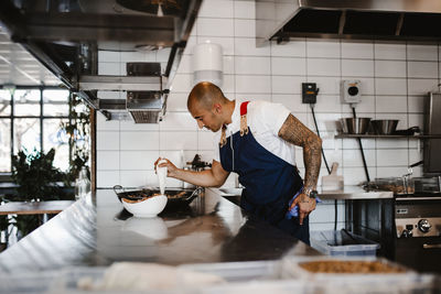 Chef preparing food in kitchen