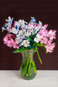 Close-up of pink flower vase on table