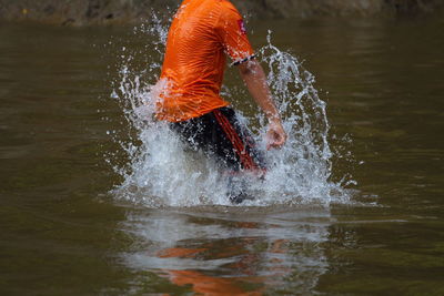 Reflection of man in water