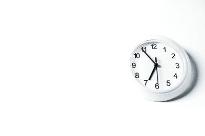 Close-up of clock against white background