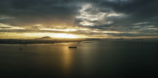 Scenic view of sea against dramatic sky