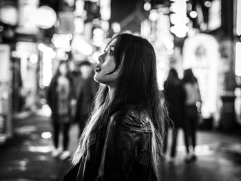 Woman standing at night