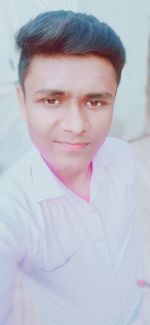 Close-up portrait of a serious young man