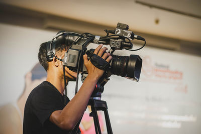 Man operating home video camera