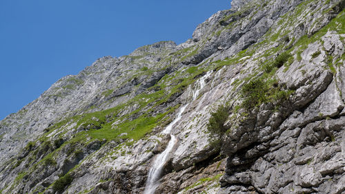 Low angle view of rock formation against clear sky