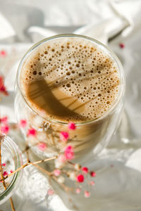 Cup of latte cappuccino. morning coffee aesthetics vibes. breakfast. pink gypsophila flowers hard 