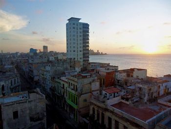 High angle view of buildings against sky during sunset