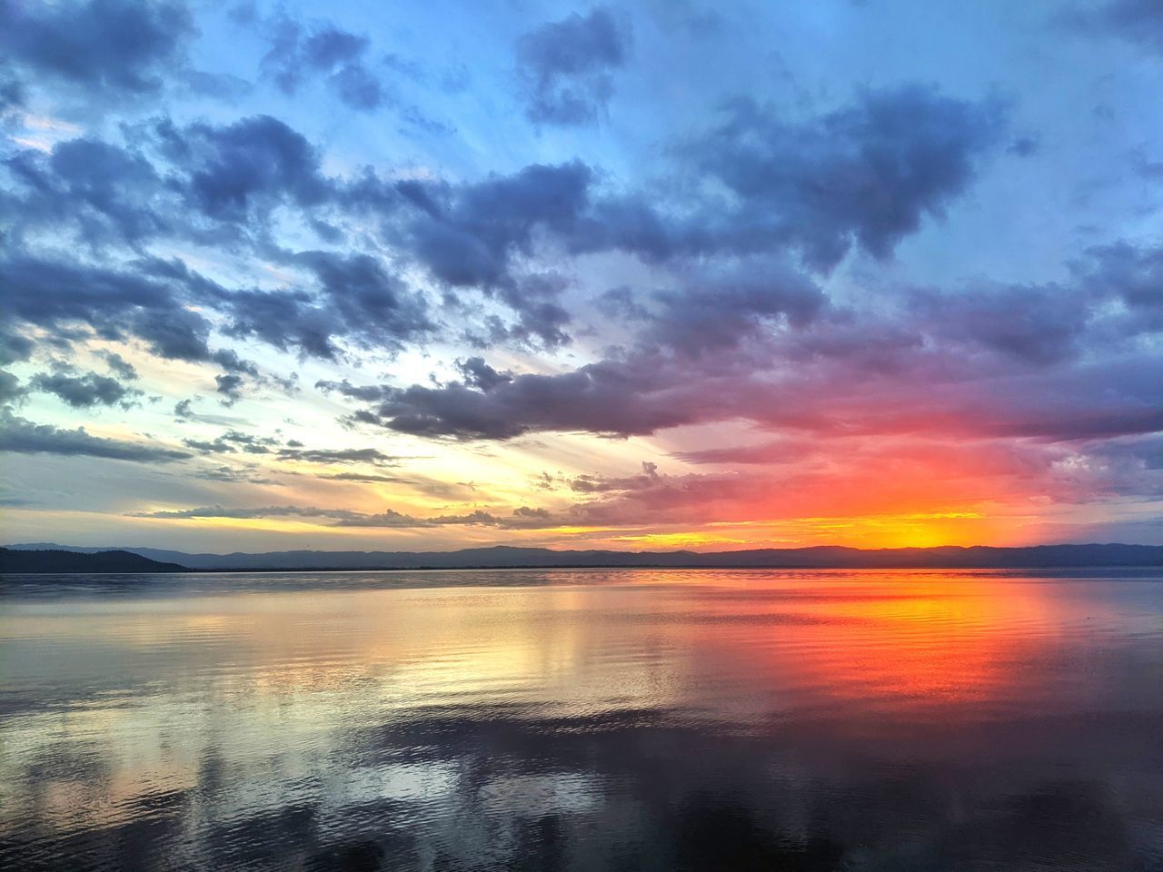 SCENIC VIEW OF SEA AGAINST ROMANTIC SKY