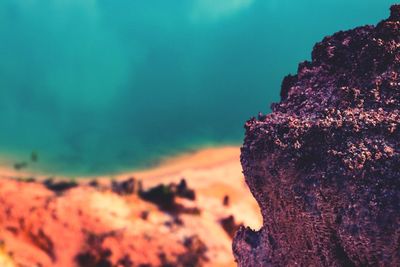 Close-up of rock against sky