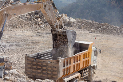 Built structure on land against mountain