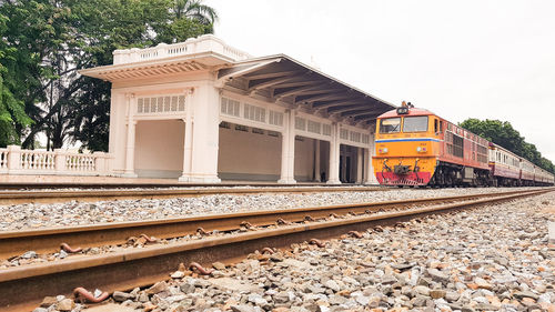 Train on railroad track against sky